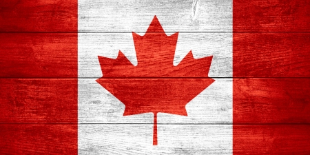 flag of Canada or  Canadian banner on wooden backgroundの写真素材