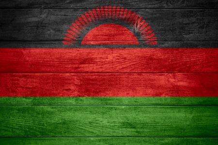 flag of Malawi or Malawian banner on wooden backgroundの写真素材
