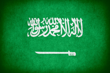 flag of Saudi Arabia or Saudi Arabian national banner on paper rough pattern textureの写真素材