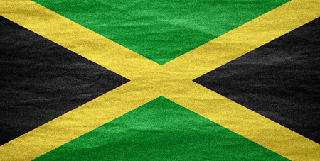 flag of Jamaica or Jamaican banner on canvas textureの写真素材