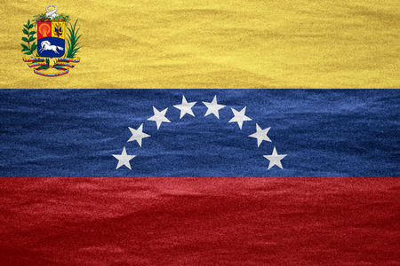 flag of Venezuela or Venezuelan banner on canvas textureの写真素材