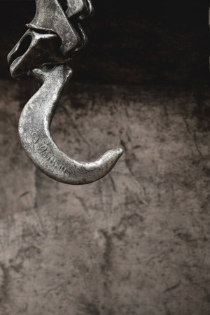 strong iron hook on abstract metal rough pattern backgroundの写真素材