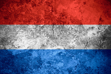 flag of Holland or Dutch banner on vintage metal textureの写真素材