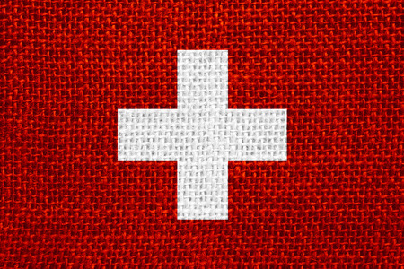 flag of Switzerland or Swiss banner on linen backgroundの写真素材