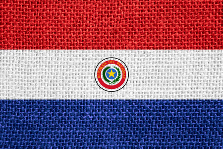 flag of Paraguay or Paraguayan banner on linen backgroundの写真素材