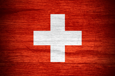 Switzerland flag or Swiss banner on wooden textureの写真素材