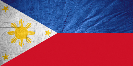 the Philippines flag or Philippine banner on wooden texture