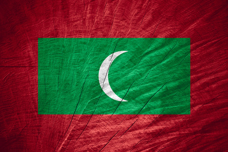 the Maldives flag or banner on wooden textureの写真素材