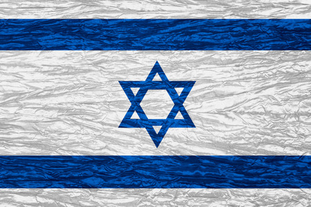 flag of Israel or Israeli banner on canvas textureの写真素材