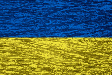 flag of Ukraine or Ukrainian banner on canvas textureの写真素材