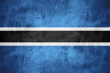 flag of Botswana or Botswanan banner on rough pattern texture backgroundの写真素材