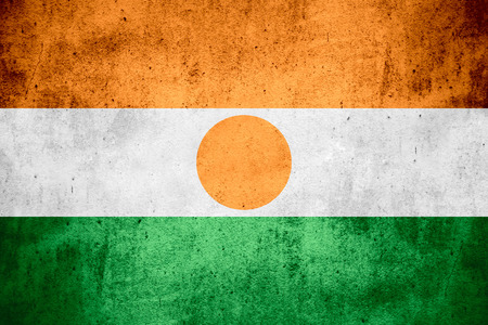 flag of Niger or Nigerian on rough pattern texture backgroundの写真素材