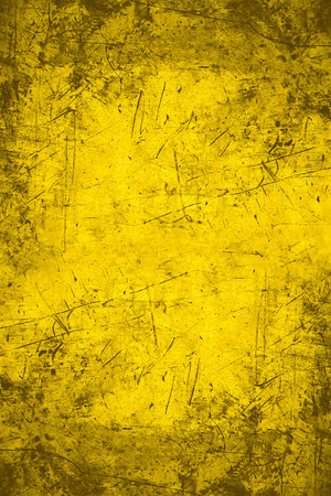 yellow abstract background or scratched metal textureの写真素材
