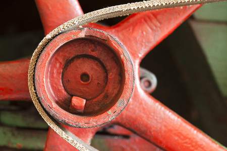 red flywheel with belt or abstract industrial backgroundの写真素材