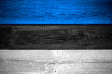flag of Estonia  or Estonian banner on wooden backgroundの写真素材