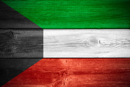flag of Kuwait or banner on wooden backgroundの写真素材