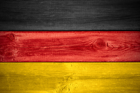 flag of  Germany or German banner on wooden backgroundの写真素材