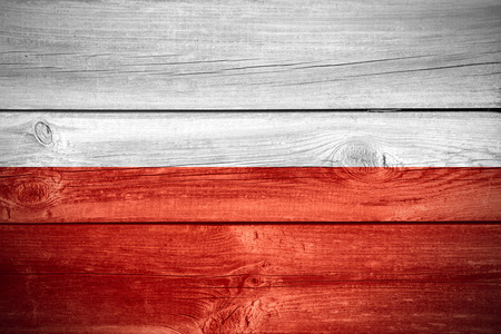 flag of Poland or Polish banner on wooden backgroundの写真素材