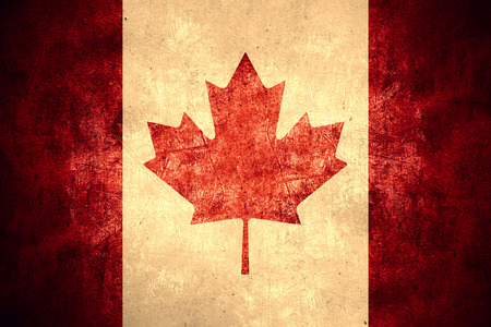 flag of Canada or Canadian on rough pattern texture backgroundの写真素材