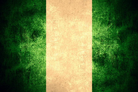 flag of Nigeria or Nigerian banner on rough pattern texture vintage backgroundの写真素材