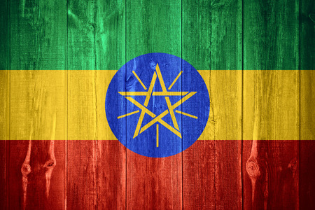 flag of Ethiopia or Ethiopia banner on wooden backgroundの写真素材
