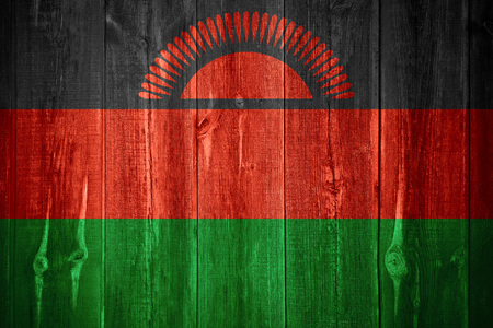 flag of Malawi or Malawian banner on wooden backgroundの写真素材
