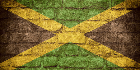 flag of Jamaica or Jamaican banner on brick textureの写真素材