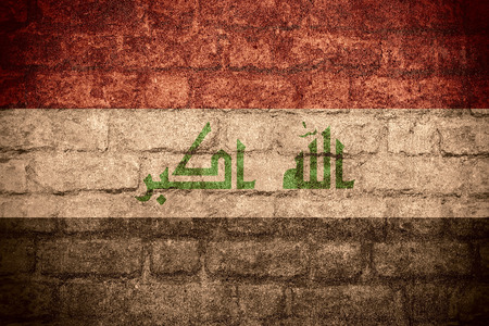 flag of Iraq or Iraqi banner on brick textureの写真素材