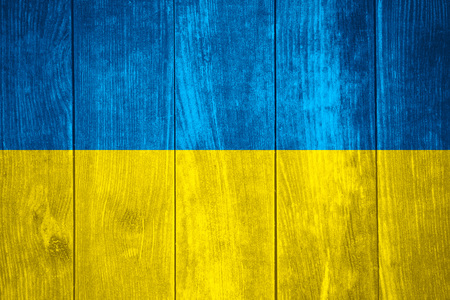flag of Ukraine or Ukrainian banner on wooden backgroundの写真素材