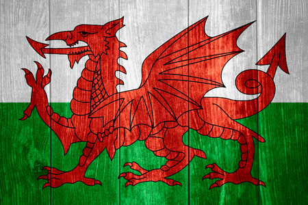 flag of Wales or Welsh banner on wooden backgroundの写真素材