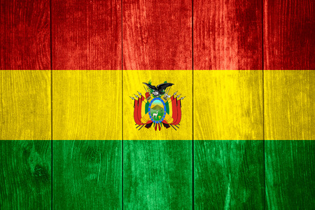 flag of Bolivia or Bolivian banner on wooden backgroundの写真素材