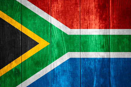 flag of South Africa or South African banner on wooden backgroundの写真素材