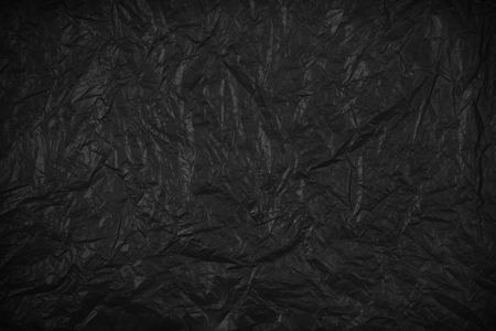 black abstract background or creased paper textureの写真素材