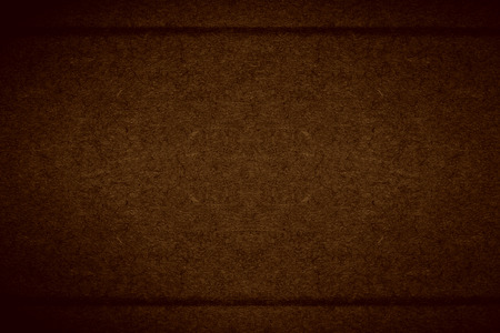 brown cardboard background with margins or rough pattern grain paper textureの写真素材