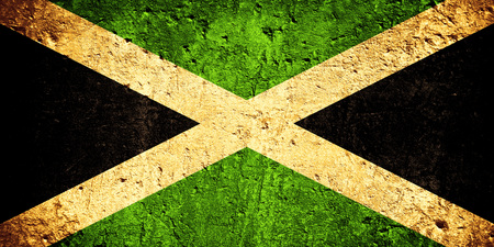 flag of Jamaica or Jamaican flag on scratched rough textureの写真素材