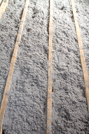 eco-friendly cellulose insulation made from recycled paper for building constructions, insulation for walls, ceiling insulation, insulation for floors, recycled newsprint, warm house, heat preservation, energy savingの写真素材
