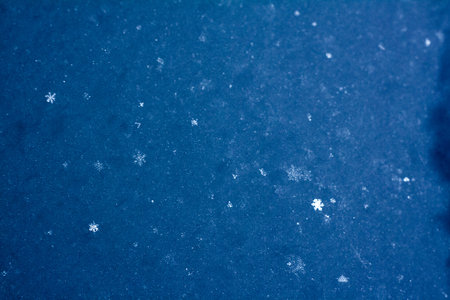 background of the fresh snow with snowflakes. winter backgroundの写真素材