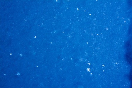 background of the fresh snow with snowflakes. winter backgroundの写真素材