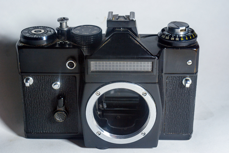 vintage film camera mechanical metal and glass isolated on the backgroundの写真素材