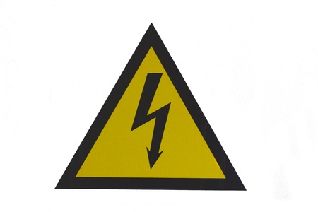 High voltage danger sign black lightning on yellow backgroundの写真素材