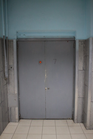 Door to the elevator in an abandoned building Old Soviet lift in the hospitalの写真素材