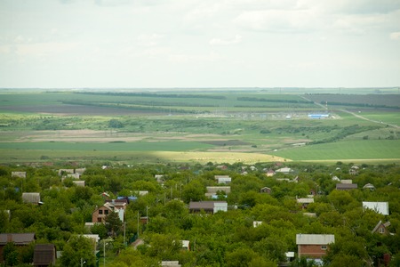 Holiday village in thick green trees houses and cottages picturesque environmentally friendly area for housingの写真素材