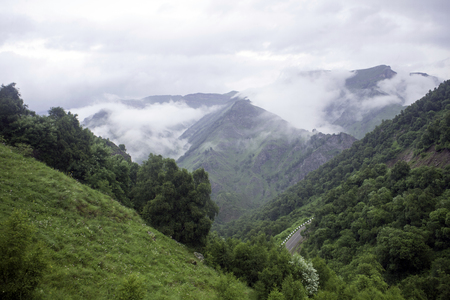 Landscape high mountains in dense fog tops of mountains in clouds North Caucasus Elbrusの写真素材