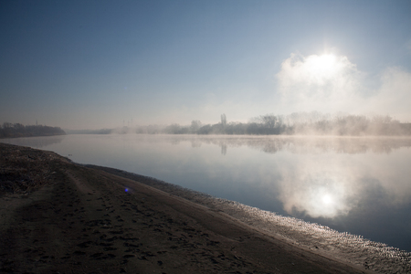 Morning on the river early morning reeds mist fog and water surface on the riverの写真素材