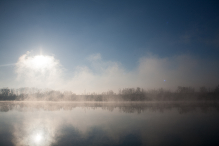 Morning on the river early morning reeds mist fog and water surface on the riverの写真素材