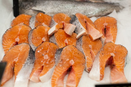 chilled steak of red sturgeon fish in ice frozen red fish steaks in a marketの写真素材