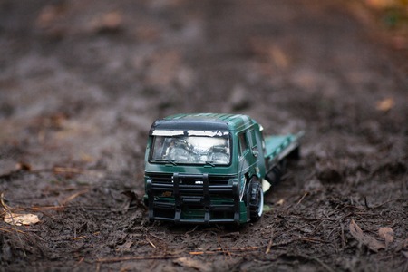 baby little truck car in the mud in the woodsの写真素材