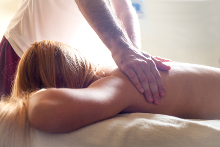 Therapeutic massage manual therapy for curing pain in the joints of the osteochondrosis of the spine of muscle relaxationの写真素材