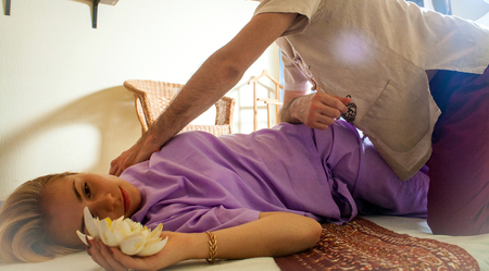 therapeutic massage manual therapy for curing pain in the joints of the osteochondrosis of the spine of muscle relaxationの写真素材