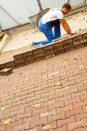 the master paves the paving slab professionallyの写真素材